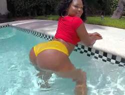 Diamond Monroe is a dark skinned sexy babe on touching monster curves! She shakes her body in the sun and right in the pool. She removes her jeans and then then her extrinsic tight lily-livered shorts. Her brown ass is something!